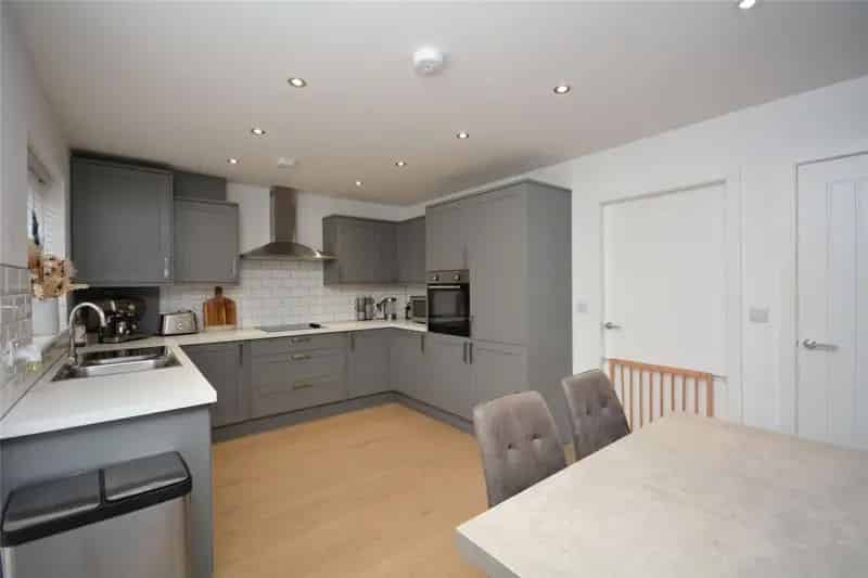 Modern Stone Semi-Detached Home with Ample Parking and Private Garden