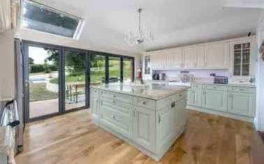 House For Sale in Holywell Lake, England