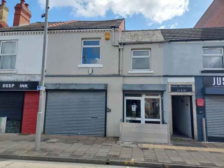 Mixed-Use Property with Lettable Flat - Investment Opportunity