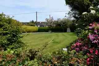 Spacious Detached Bungalow with Integral Garage and Mature Gardens