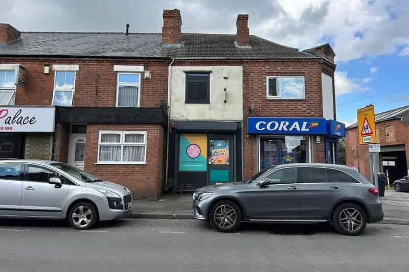 Two-Storey Brick Property with Shop Frontage and Flying Freehold