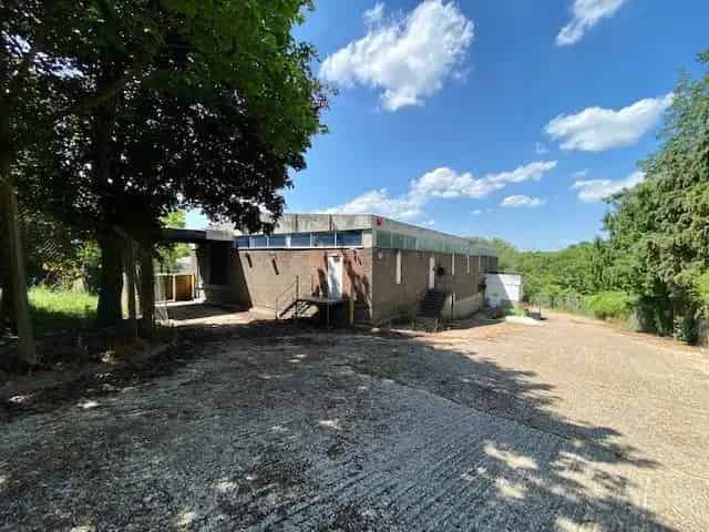 Detached Building with Ample Parking and Secure Yard Ideal for Self Storage