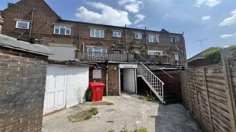 Three-Story Mid-Terraced Building with Takeaway Unit and Flats
