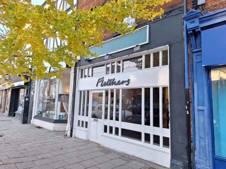 Three-Storey Building with Retail Space and Parking