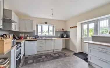 Detached Home with Outbuildings and Ample Parking