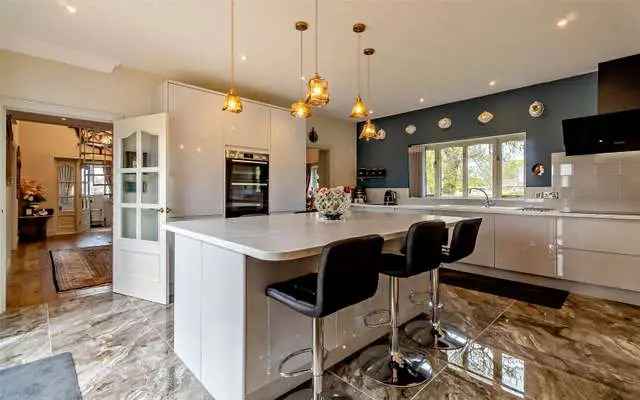 Spacious Village Home with Stunning Gardens and Double Garage