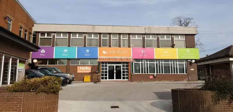 Two Story Brick Building with Open Plan Office Space and Ample Parking