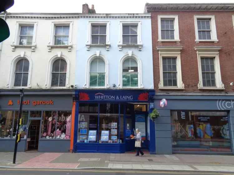 Four-Story Commercial Building with Retail and Office Space