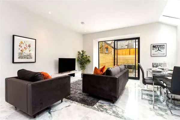Spacious 3-Storey House with West-Facing Garden