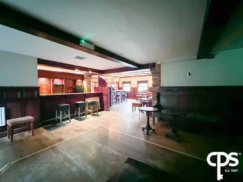 Spacious Country Pub with Ample Parking and Multiple Bars