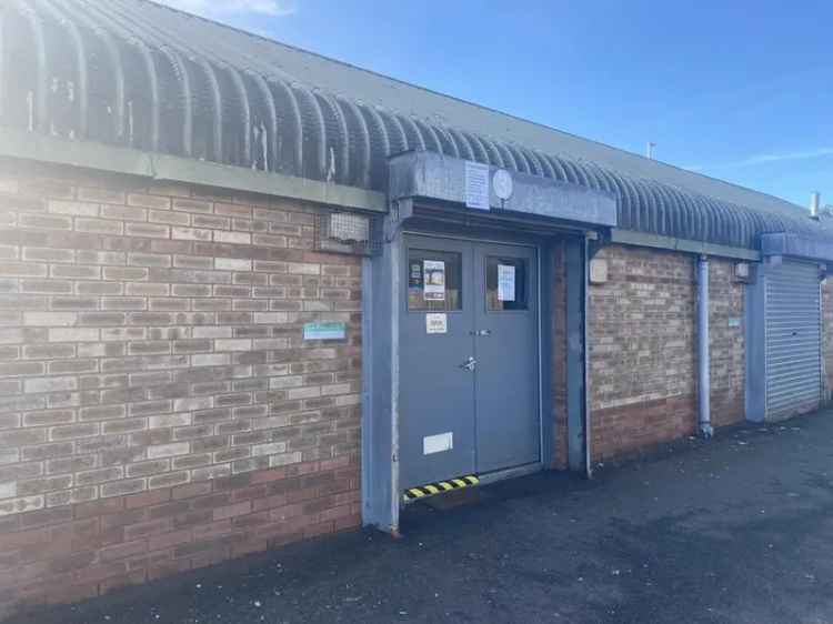 Industrial Unit: Brick Building with Car Parking