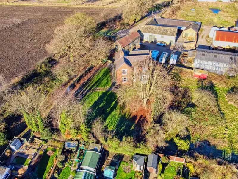 Spacious Farmhouse with Extensive Farm Buildings and Land near Chesterfield