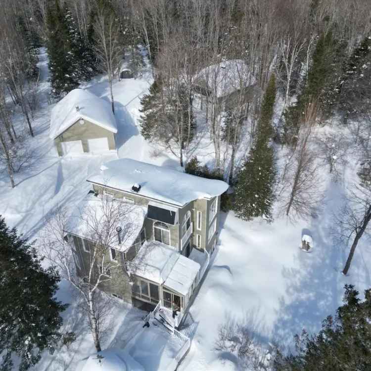 Wooded Retreat near Eastman Village: Lakefront Home with 2 Garages