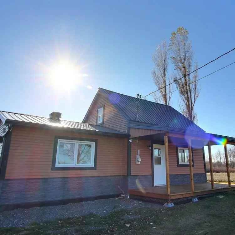 Renovated House with Garage and Porch in Rural Setting