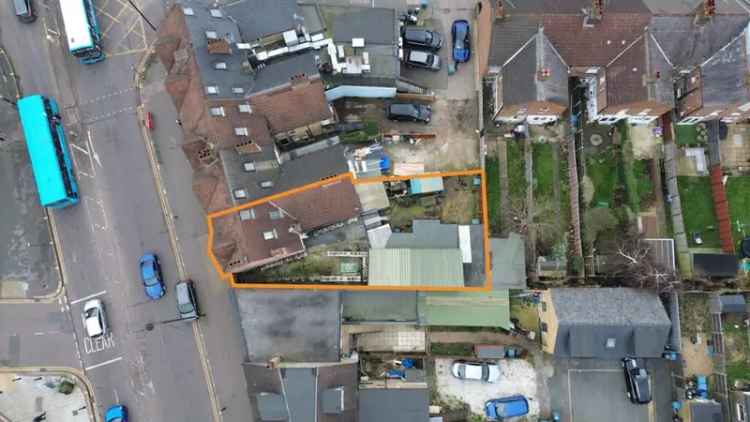Retail Unit with 3-Bedroom Flat and Outbuildings Near Watford Junction