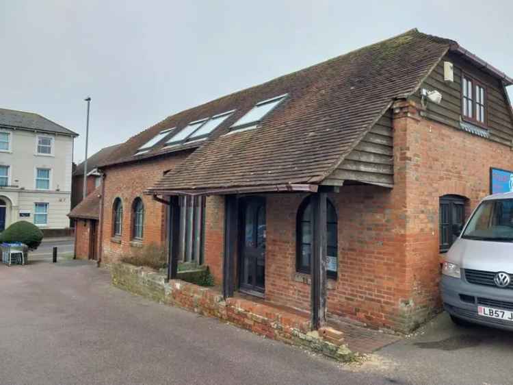 Self Contained Building with Exposed Beams and Skylights