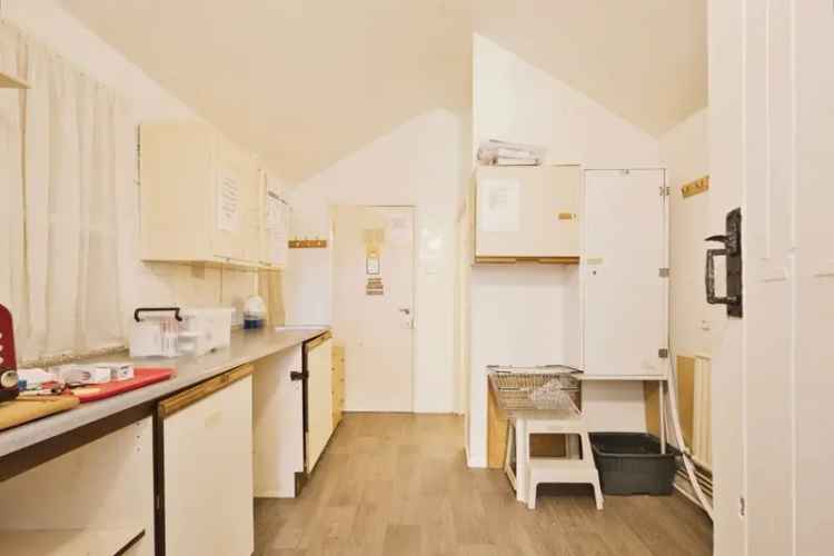10-Bedroom Property with Large Gardens and Ample Parking