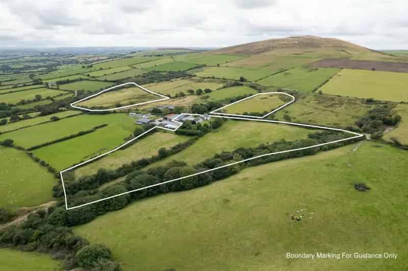 Country Farmhouse with 26 Acres and Equestrian Facilities
