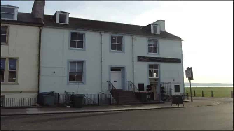 Two-Story Townhouse with Shop Unit and Rental Income Potential