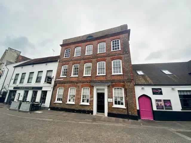 Three Story Brick Building with Multiple Offices and Courtyard