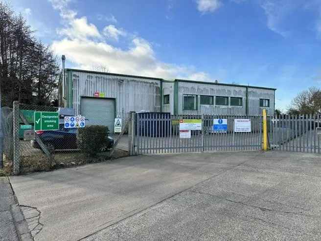 Modern Industrial Building with Two-Storey Office Module and Ample Parking