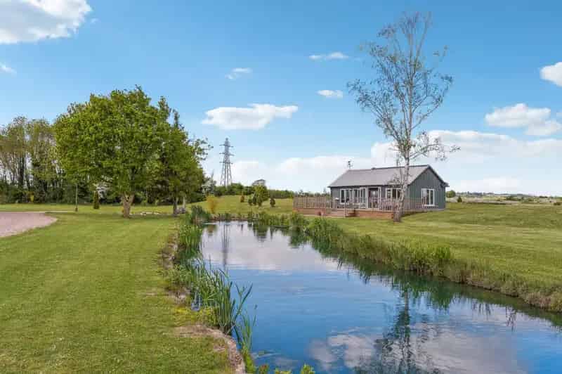 Exceptional Six Bedroom Farmhouse with 15.5 Acres and Fishing Lakes