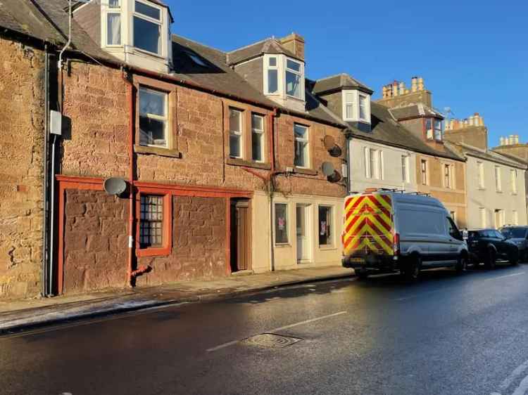 Redevelopment Opportunity: Small Retail Unit in Traditional Tenement