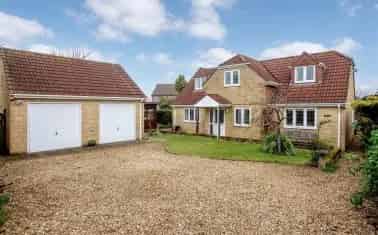 Spacious Detached Chalet Home with Double Garage and Gardens