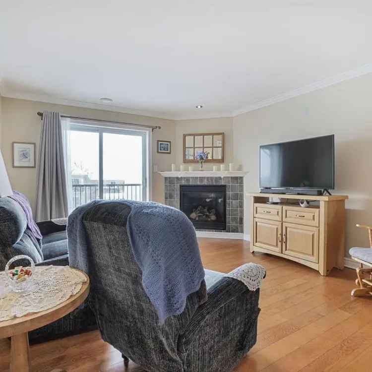 Bright 2nd Floor Condo with Fireplace and 2 Balconies