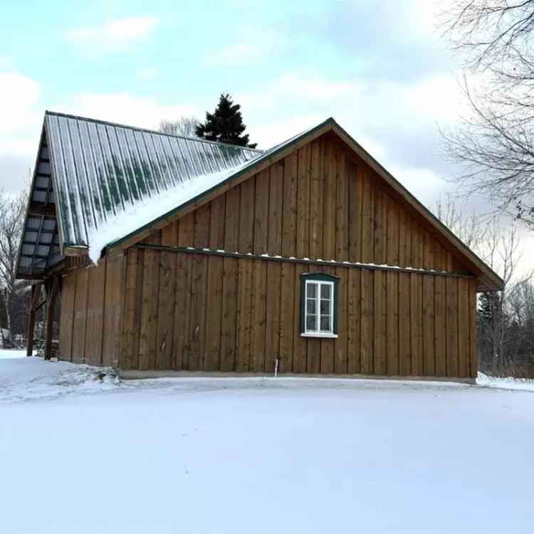 Stunning 3-Story Estate with 5 Fields and Hunting Camp