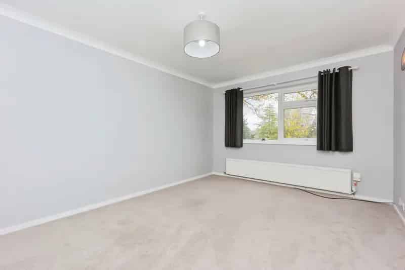 Spacious 2-Bed Top Floor Apartment with Garage Near Brooklands Metrolink