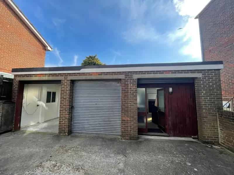 Triple Lock-Up Unit with Roller Shutter Doors and Skylights