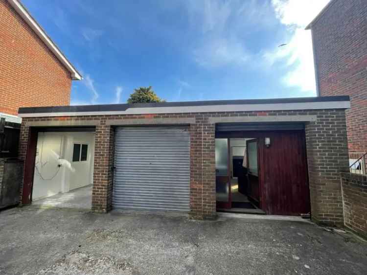 Triple Lock-Up Unit with Roller Shutter Doors and Skylights