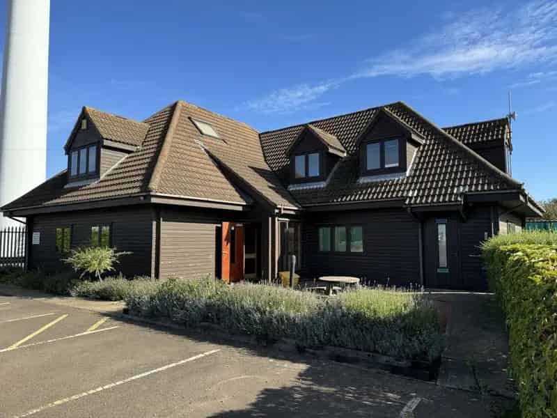 Wooden Clad Office Building with Ample Parking