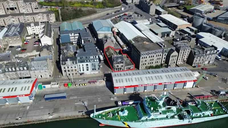 Granite Building with Office Space and Adjacent Retail Unit