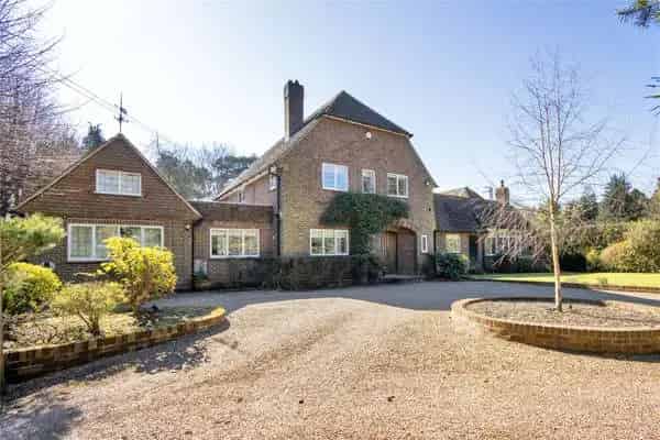Family Home with Spacious Living, Secluded Garden, and Triple Garage