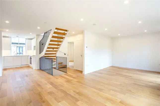 Mews house to rent in Russell Gardens Mews, London W14