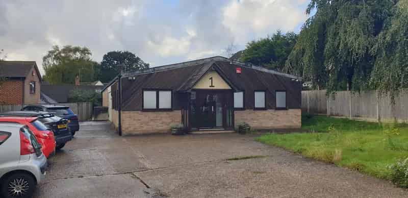 Detached Building Near Railway Station with Extensive Parking