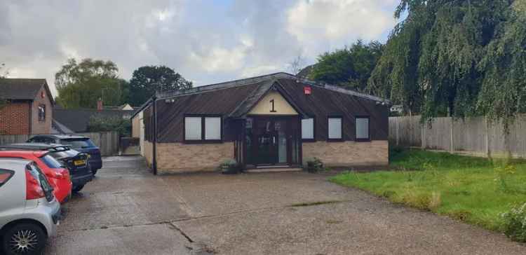 Detached Building Near Railway Station with Extensive Parking