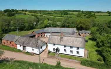 Spacious Family Home with Extensive Outbuildings and Land
