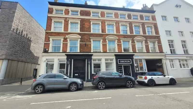 Victorian Brick Building with 9 Flats and Ground Floor Commercial Space