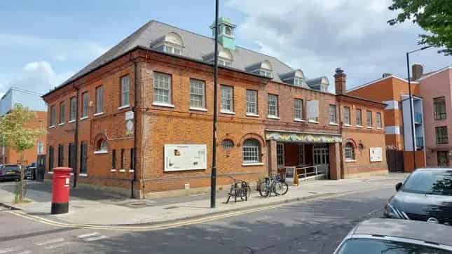 Two-Story Building with Open Plan Accommodation and Parking