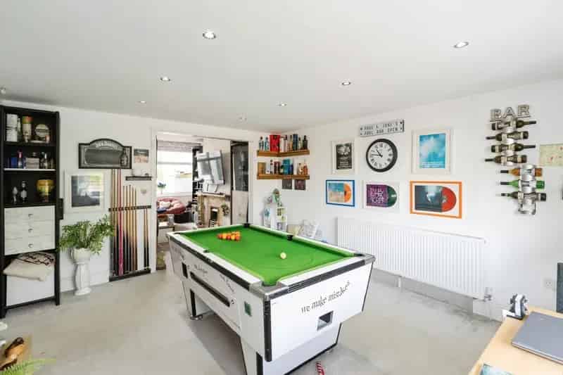 Spacious Mid-Terraced Property with Games Room and Detached Garage