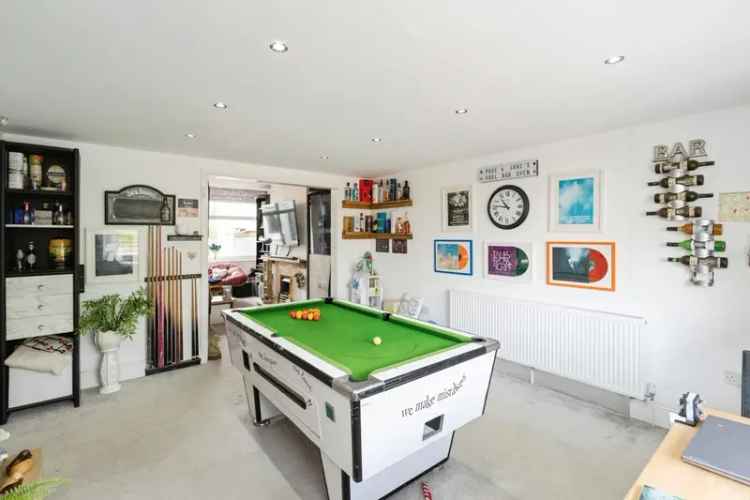 Spacious Mid-Terraced Property with Games Room and Detached Garage