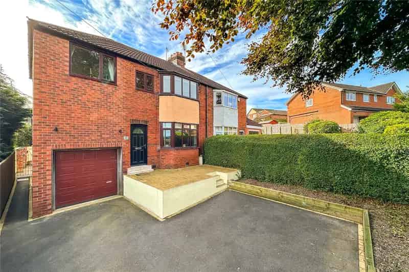 Extended Four-Bedroom Semi-Detached Home with Garage and Landscaped Garden