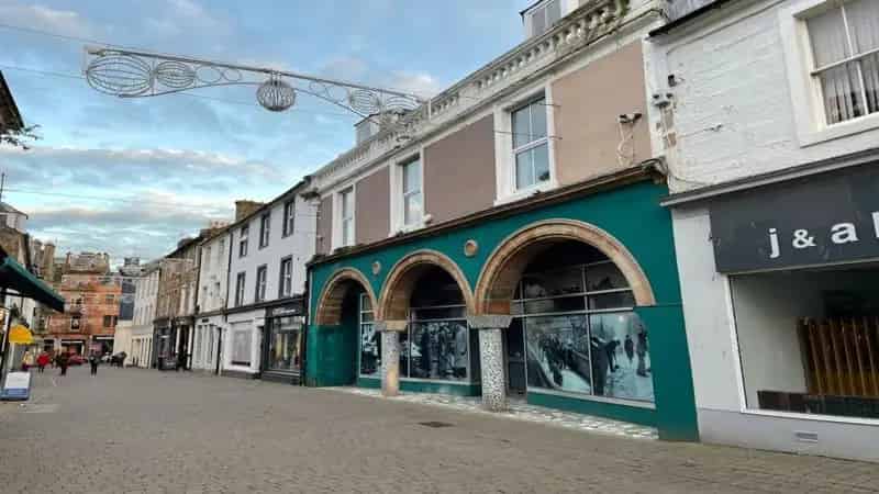 Two Story Town Center Property with Retail Space and Flats